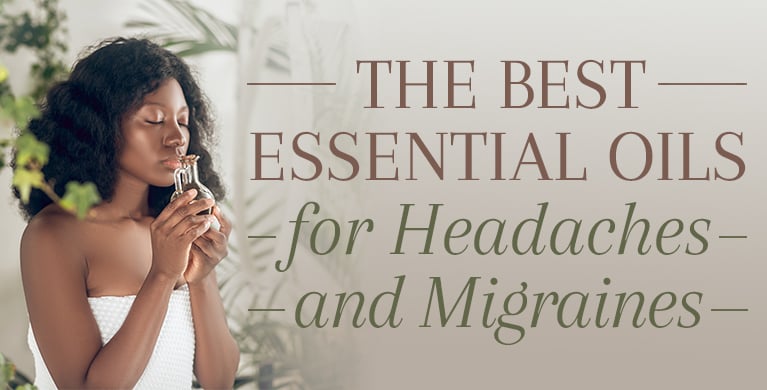 A woman is using an essential oil to get releif from headache